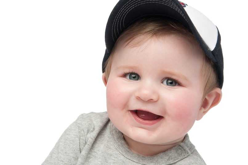 Smiling boy in front of white background