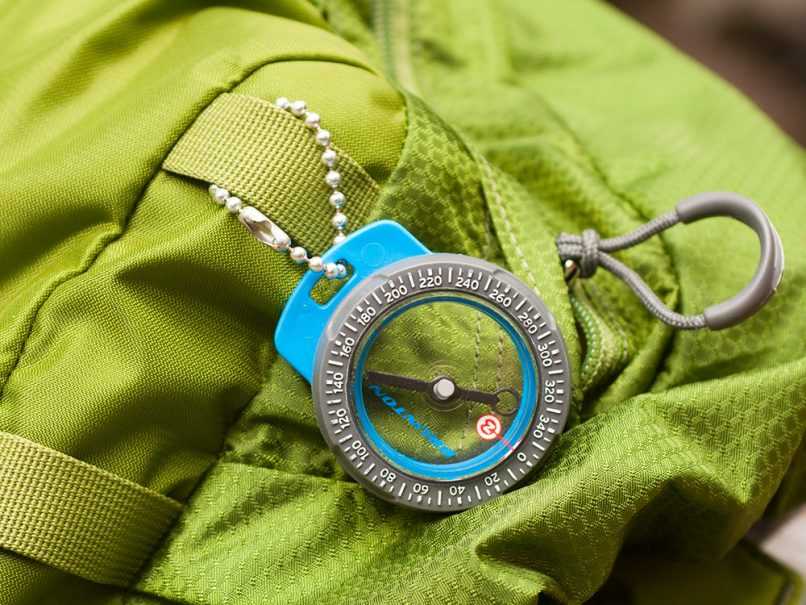 Compass hanging from back pack