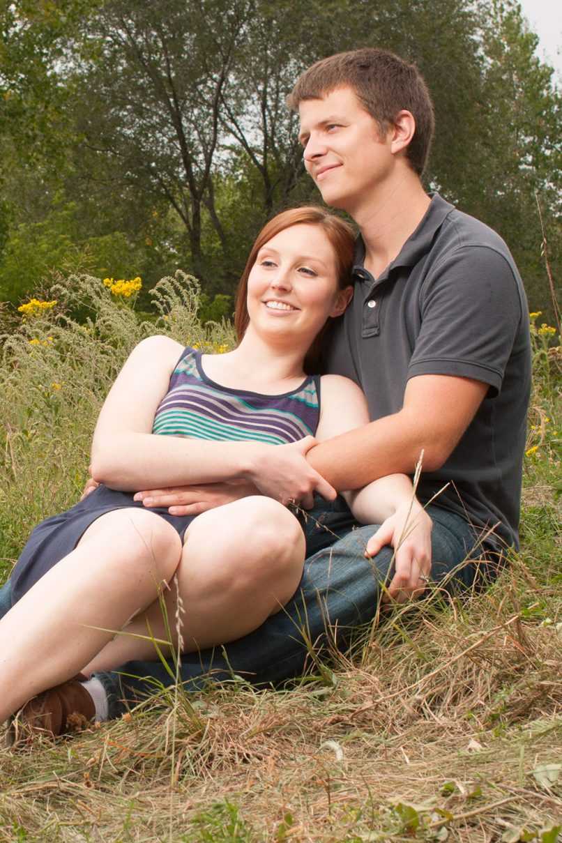 Happy couple relaxing in grass