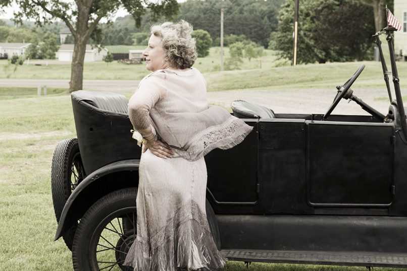 Woman posing in front of Model T
