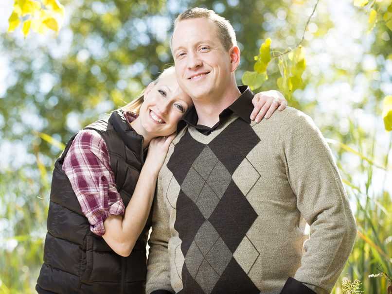 Happy couple posing in sunshine