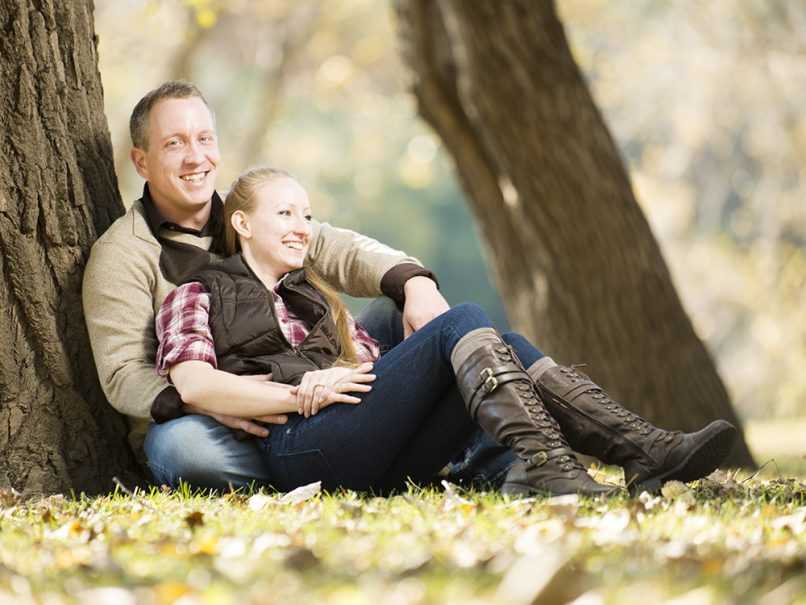 Happy couple relaxing in grass